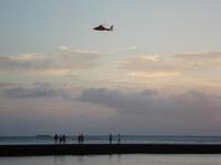 Sunset Waikiki Beach... see the helicopter there was an accident in a dinner cruise boat that night , the mast of the sailboat fell on passengers and killed one of them.