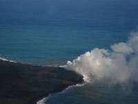 The lava flowing into the ocean