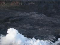 The lava flowing into the ocean