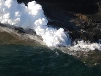 The lava flowing into the ocean